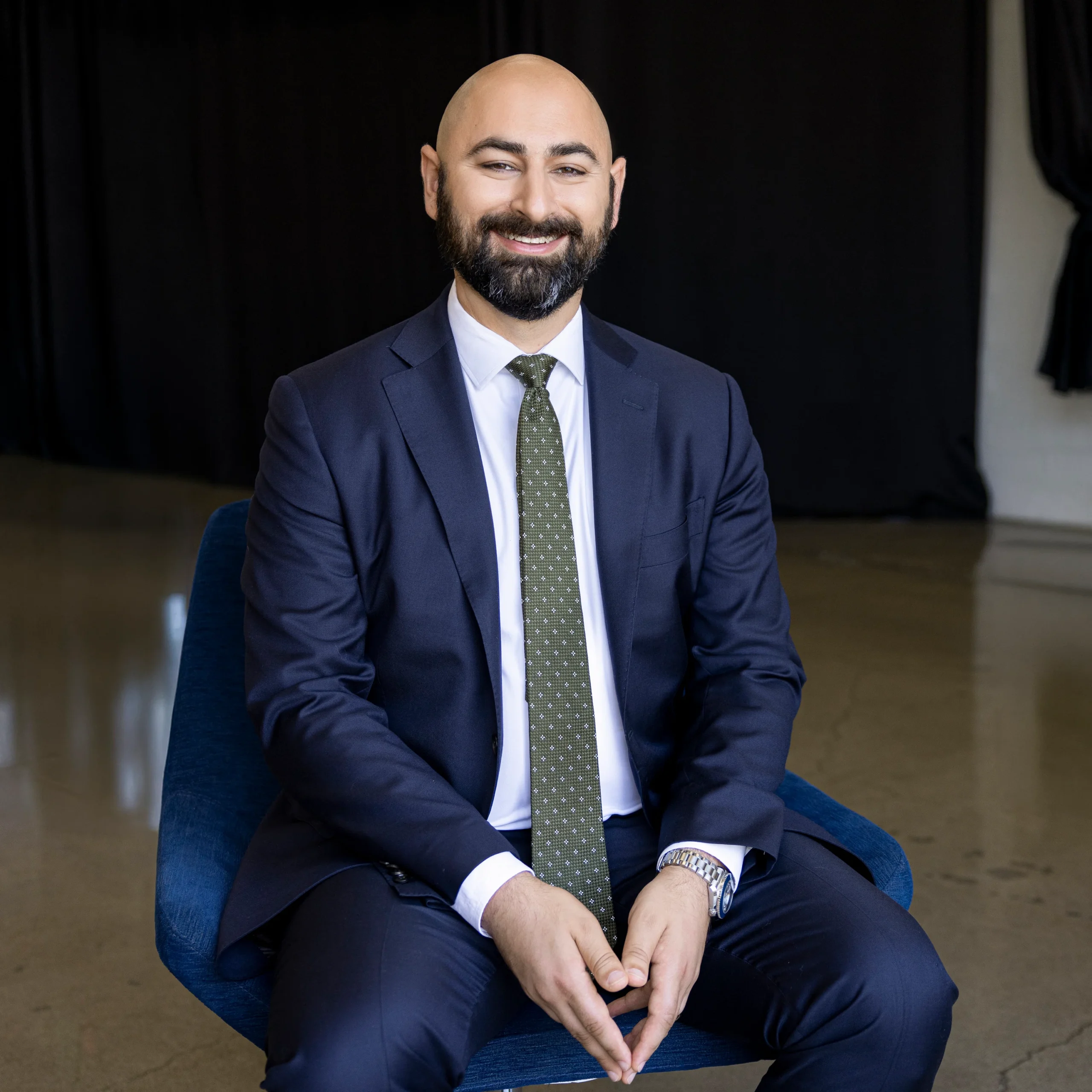 Attorney Andreas Petasis seated